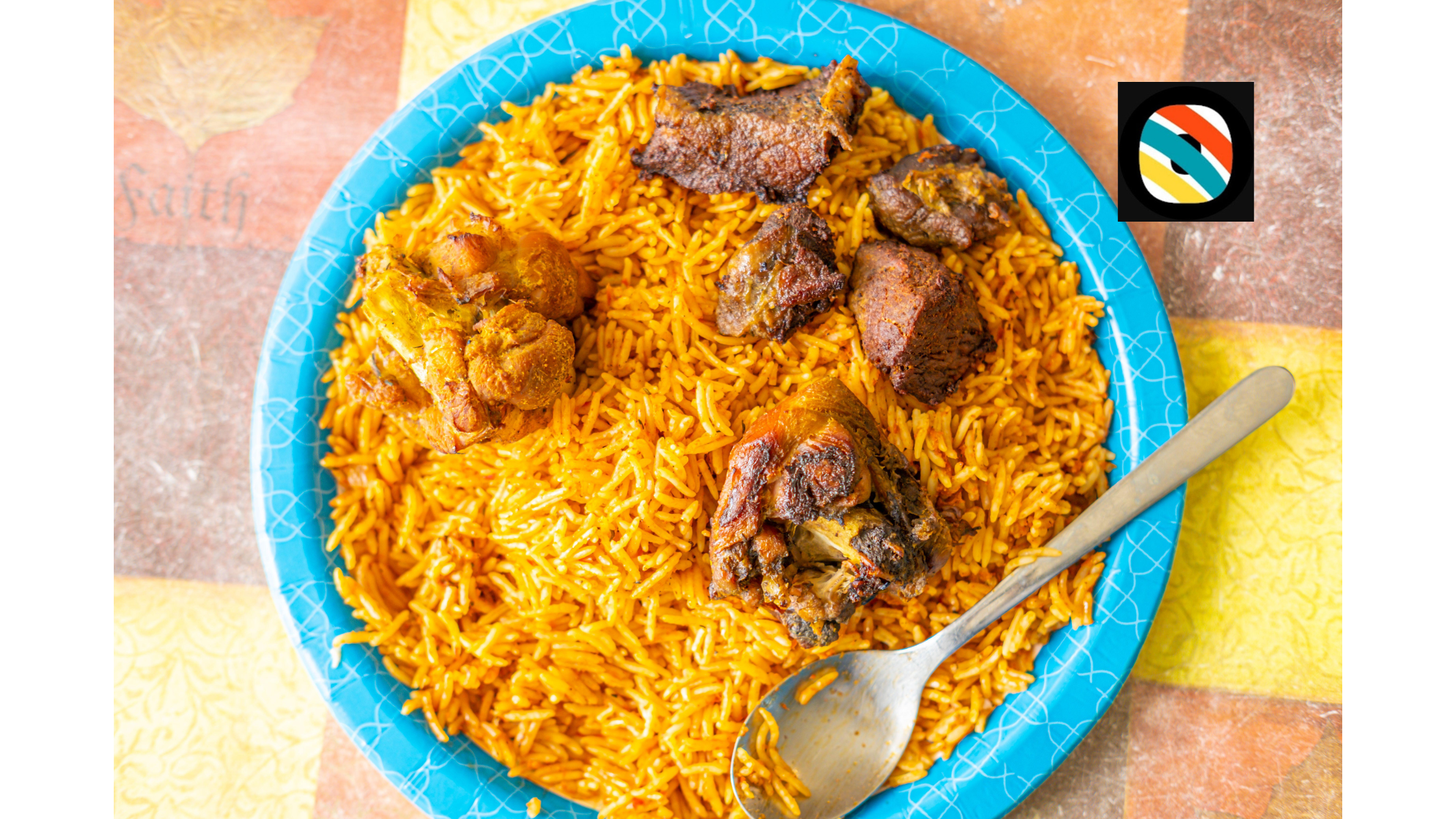 Nigerian jollof rice served with fried meat