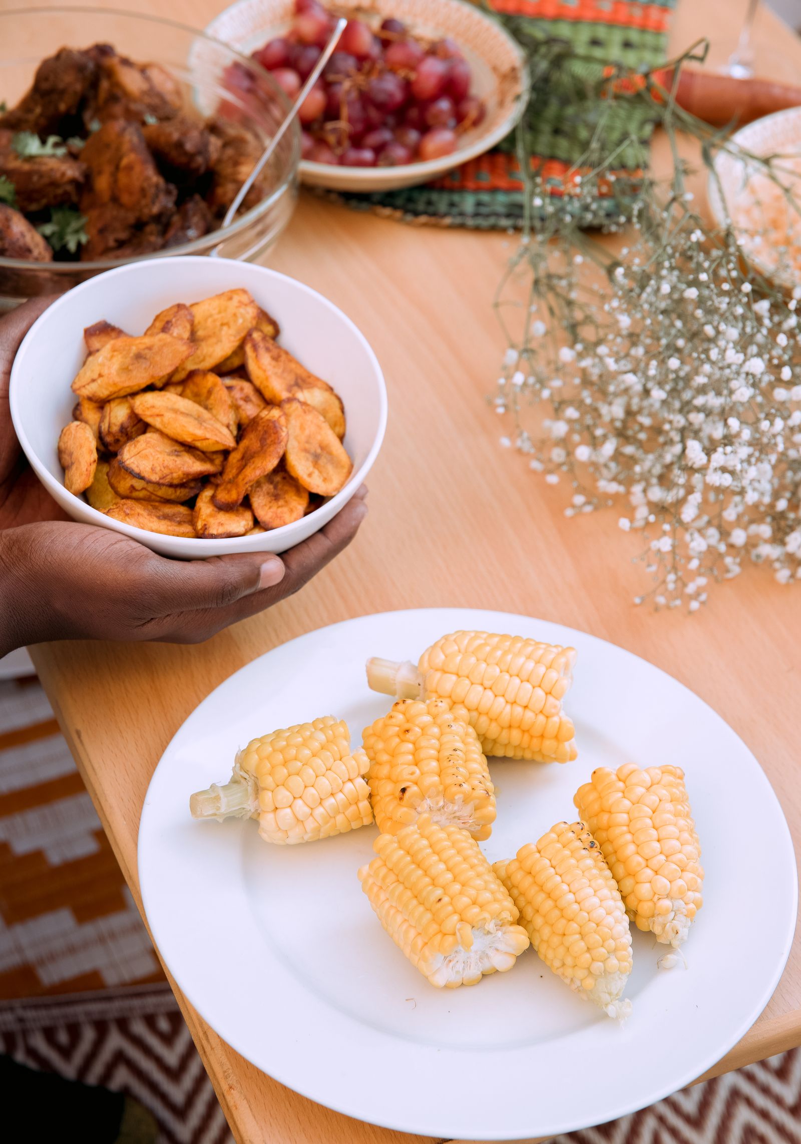 Golden fried plantain served at a family table